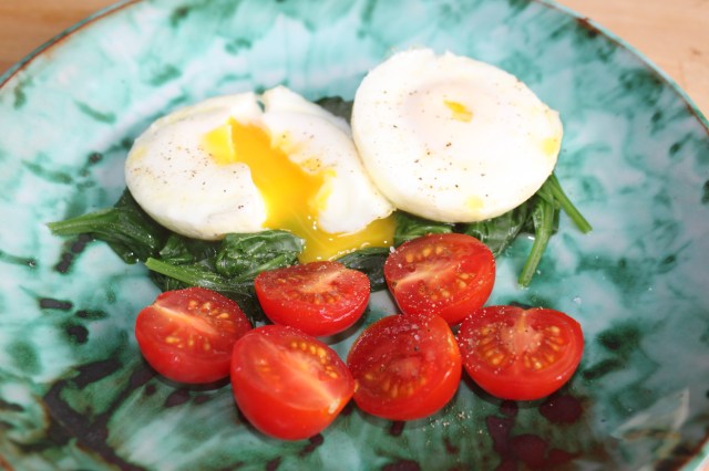 Poached eggs on wilted spinach