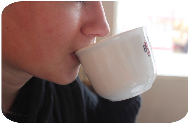 Lara drinking coffee