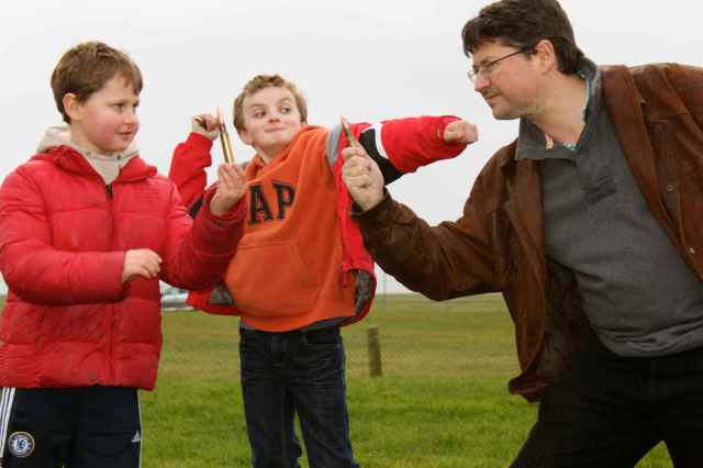 Boys holding bullets