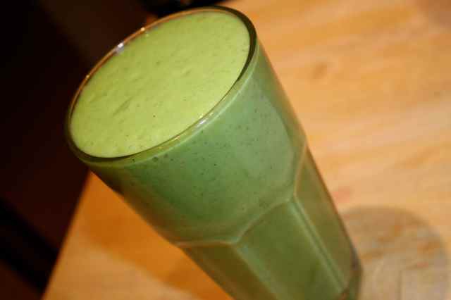 green smoothie in tall glass