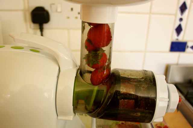 strawberries in juicer