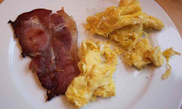 scrambled egg and 1 bacon rasher