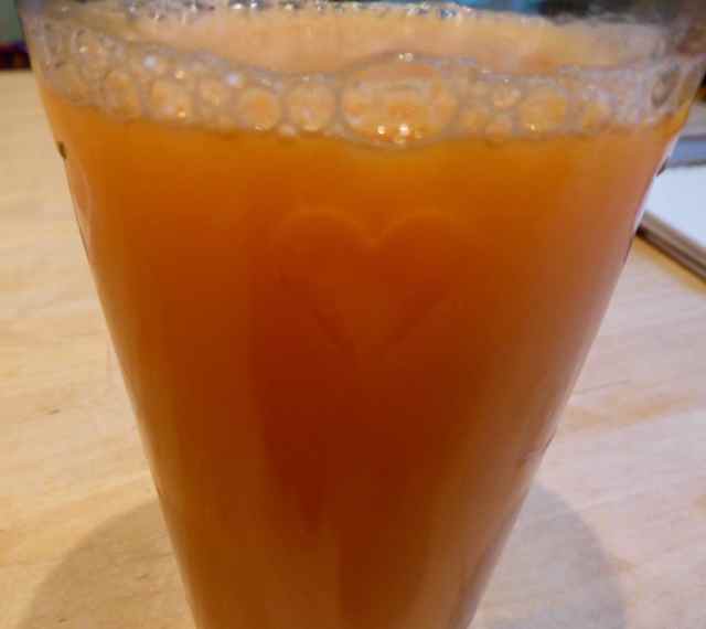 orange juice in heart glass