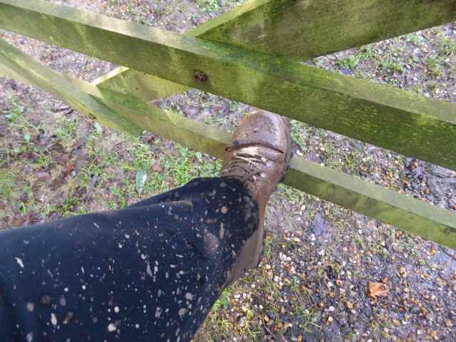 muddy boot on gate