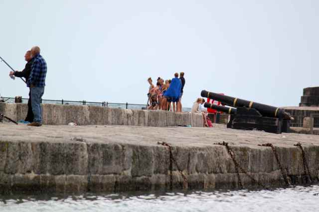 children jumping in to the sea