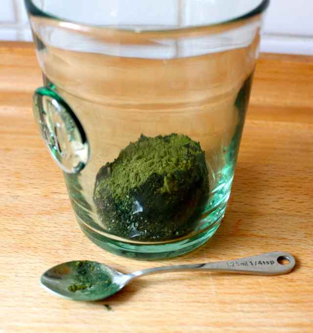 green powder in glass