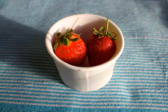 strawberries in white pot