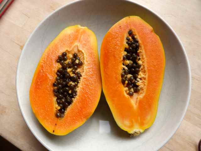 papaya in white bowl